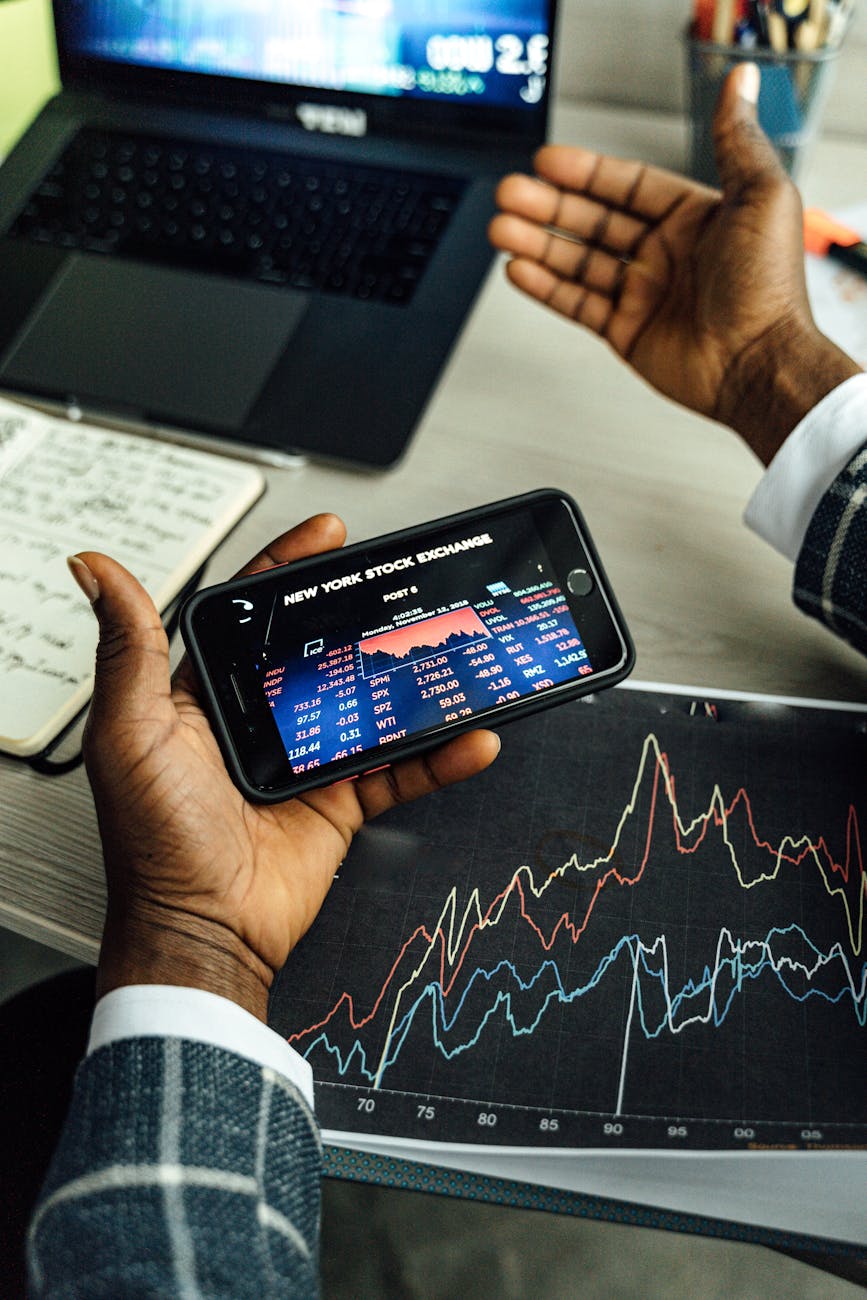 a person using a smartphone and doing trade management